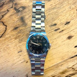 Michael Kors boyfriend watch.  Black background with multi color glitter.